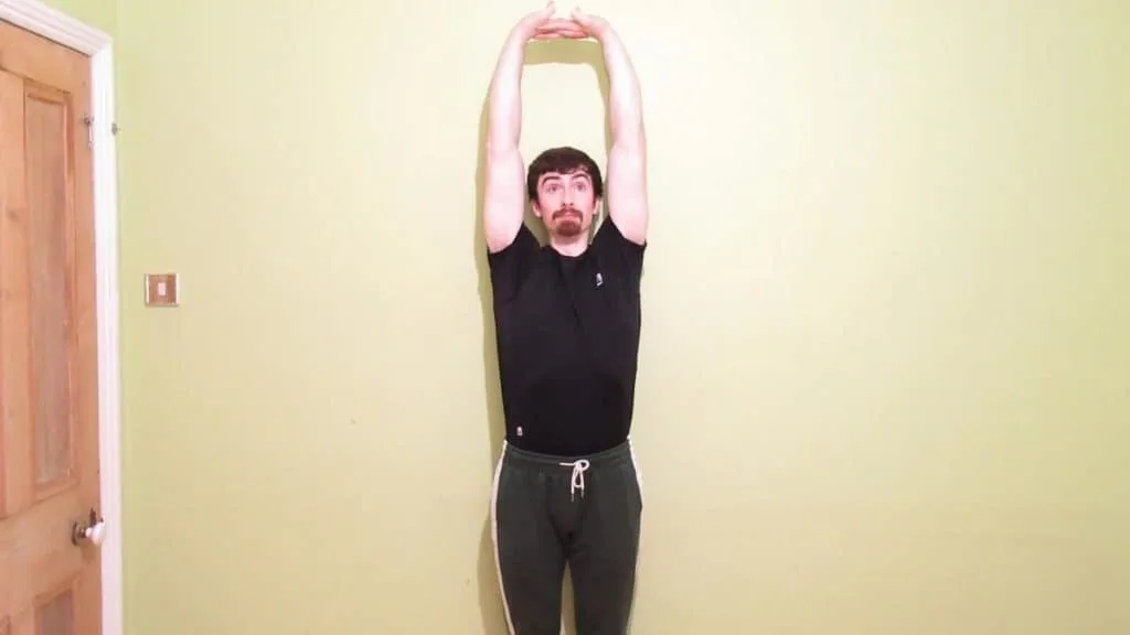 A man stretching his tight forearms