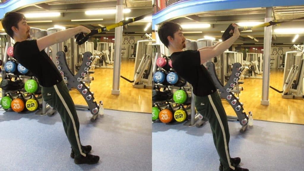 A man doing a TRX wrist curl for his forearms