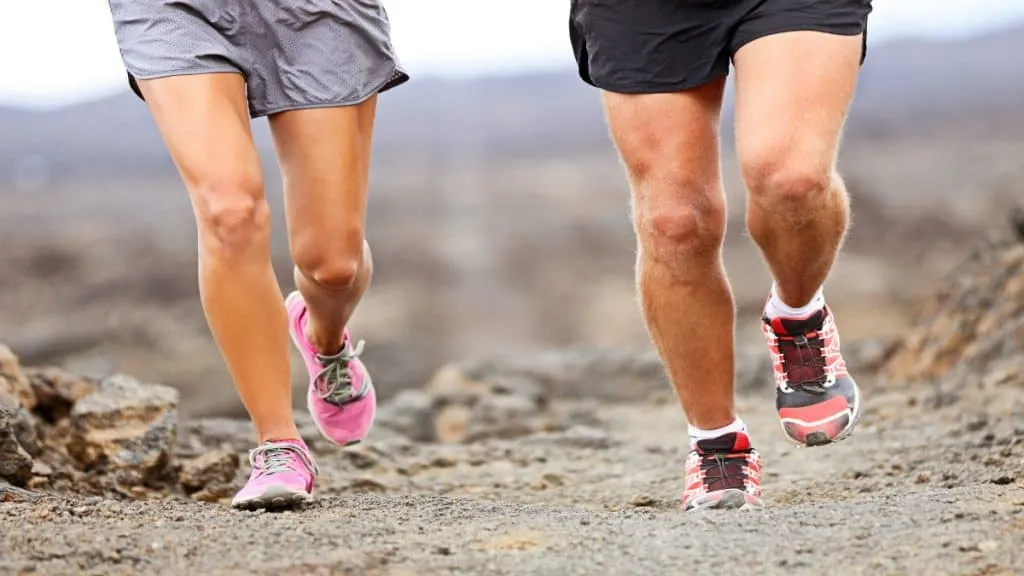 Close up of two runner's legs