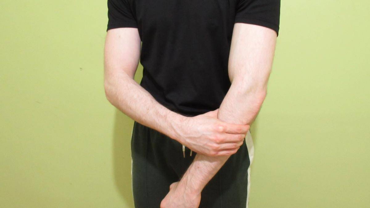 A man with weak forearm muscles due to an injury