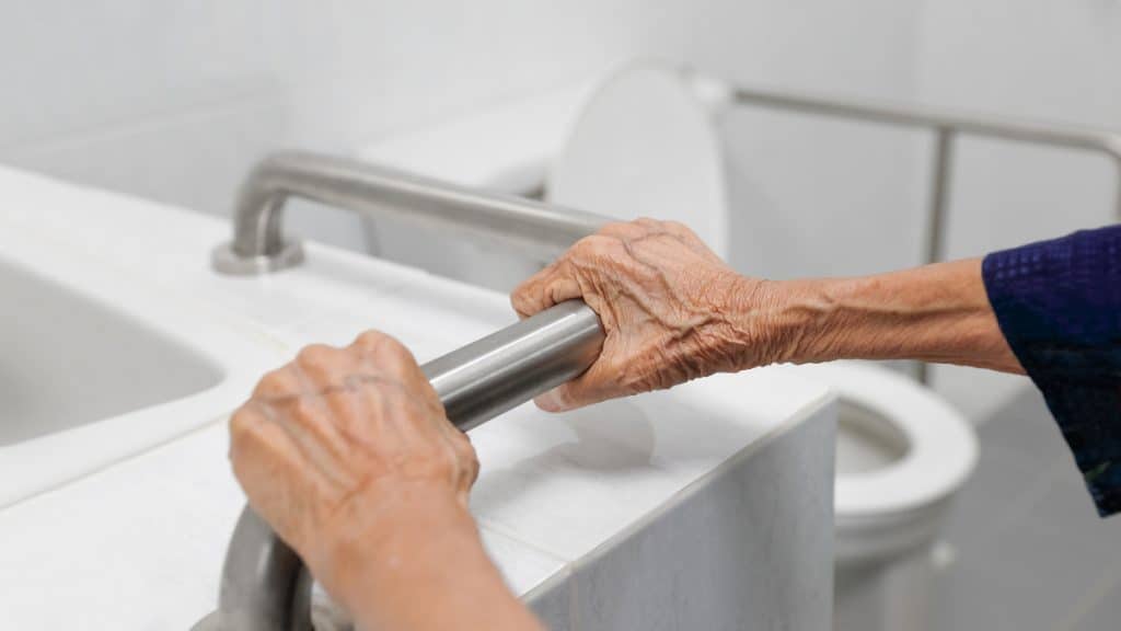 An elderly lady with weak forearms and hands