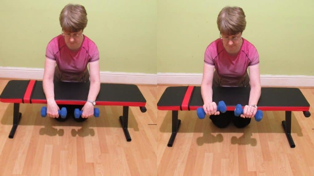 A woman doing a reverse wrist curl to work her forearms