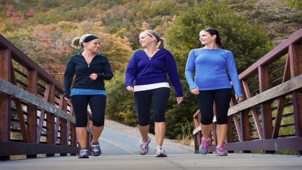 Three women walking outside