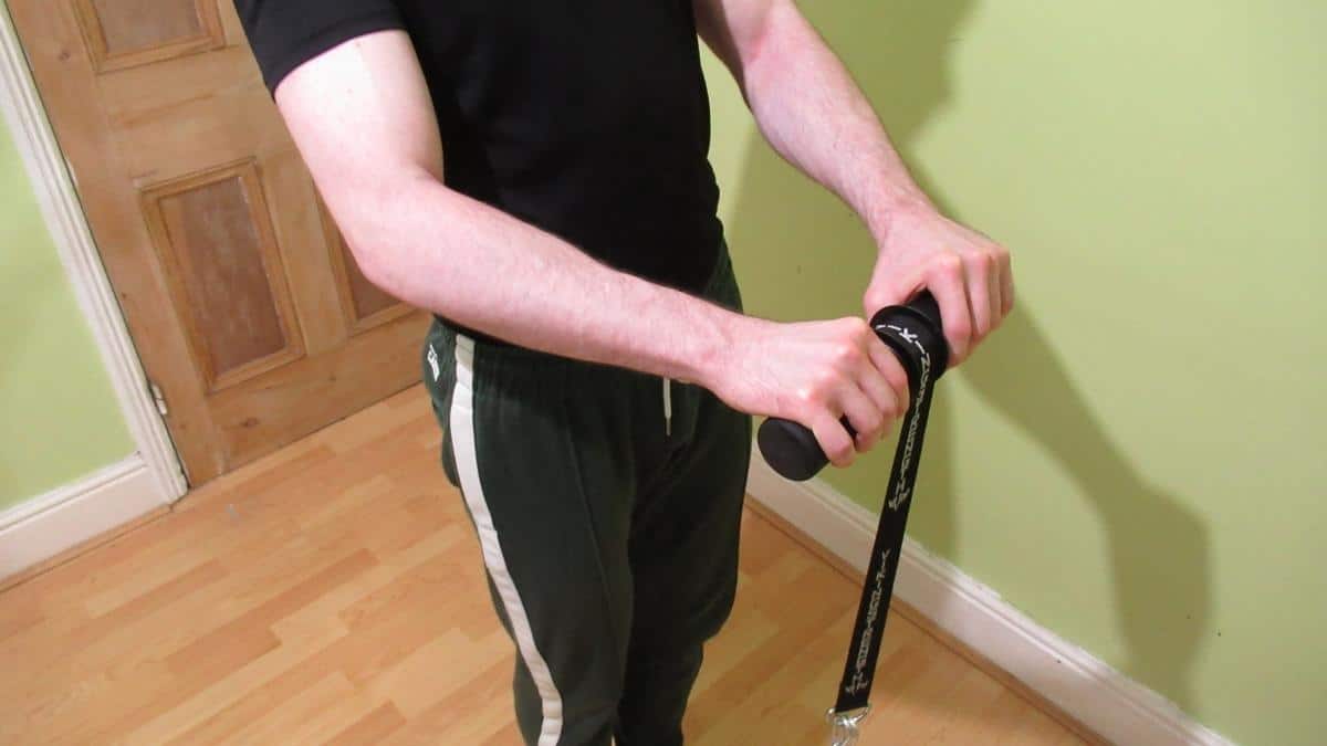 A weight lifter using his wrist and forearm blaster