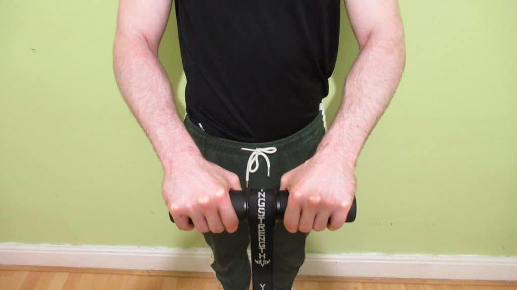 A man performing a wrist and forearm blaster workout