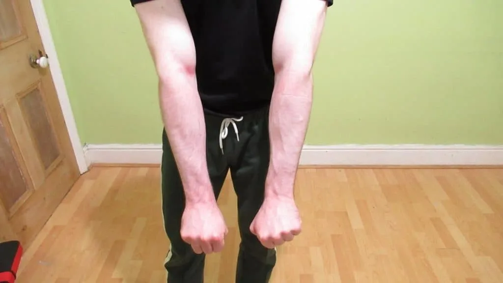 A man flexing his wrist extensors