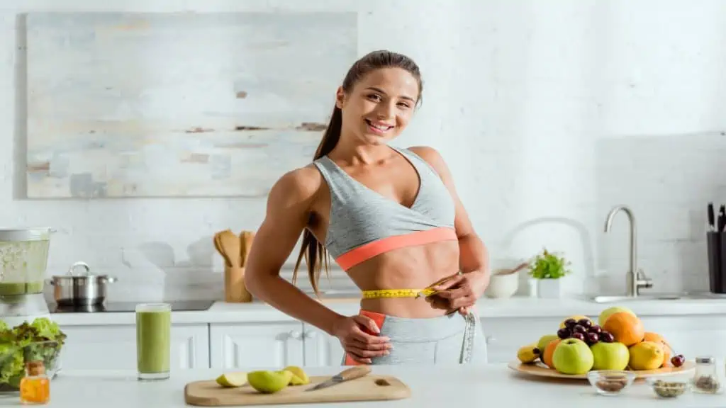 A woman showing off her celebrity-like 25 inch waist