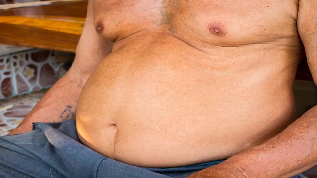 Close up of an overweight man's 48 inch waist