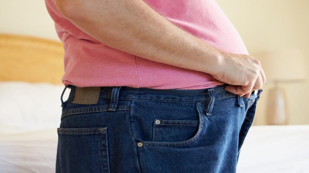 Close up of an obese man's 49 in waist