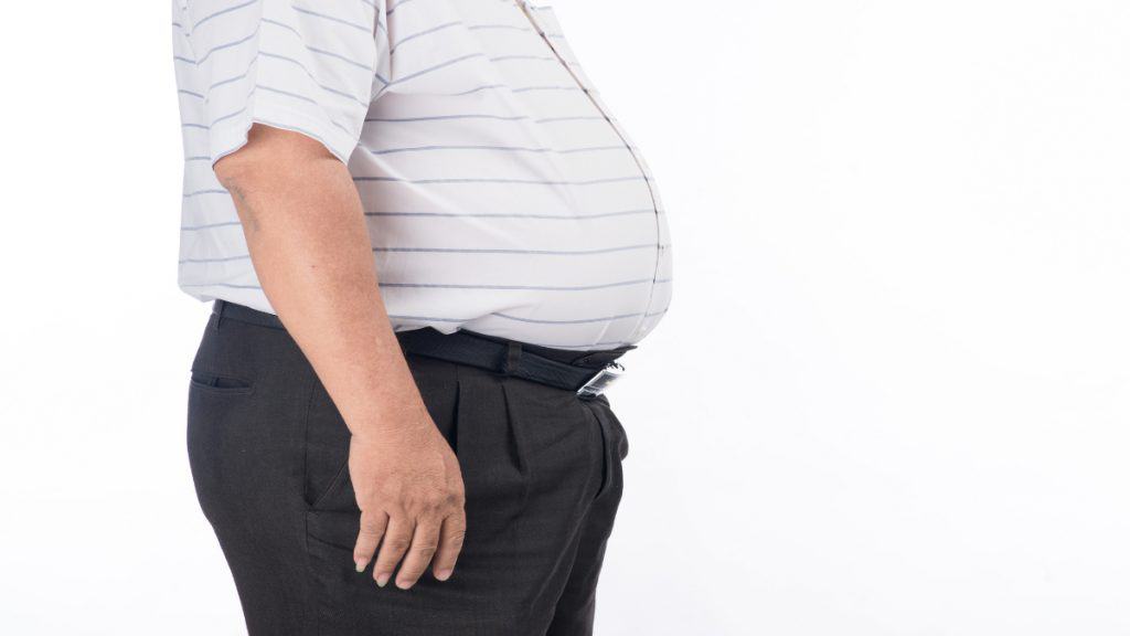 Close up of an obese man's 63 inch waistline