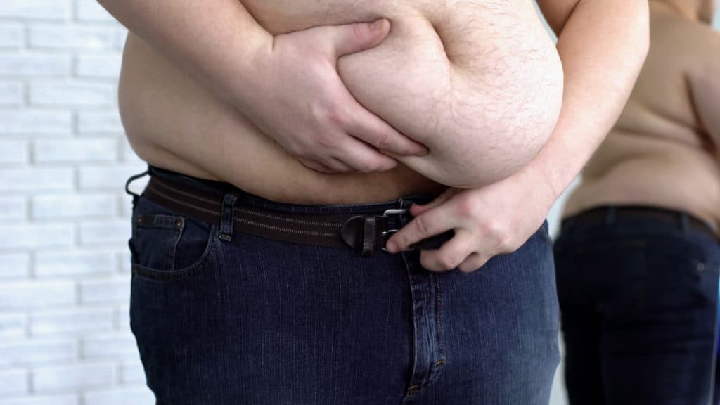 Close up of a fat man's big 70 inch waist