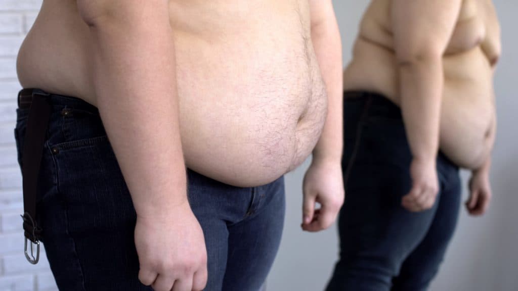 Close up of an obese man's 74 inch waist