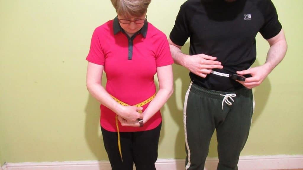 A male and a female trying to work out the average waist measurement for each gender