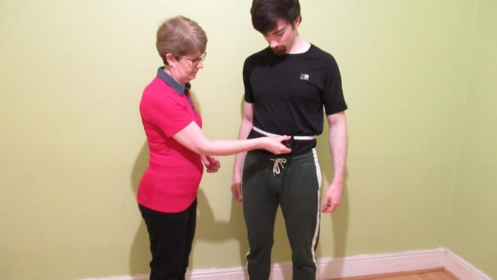 A man and a woman demonstrating what is considered a small waist