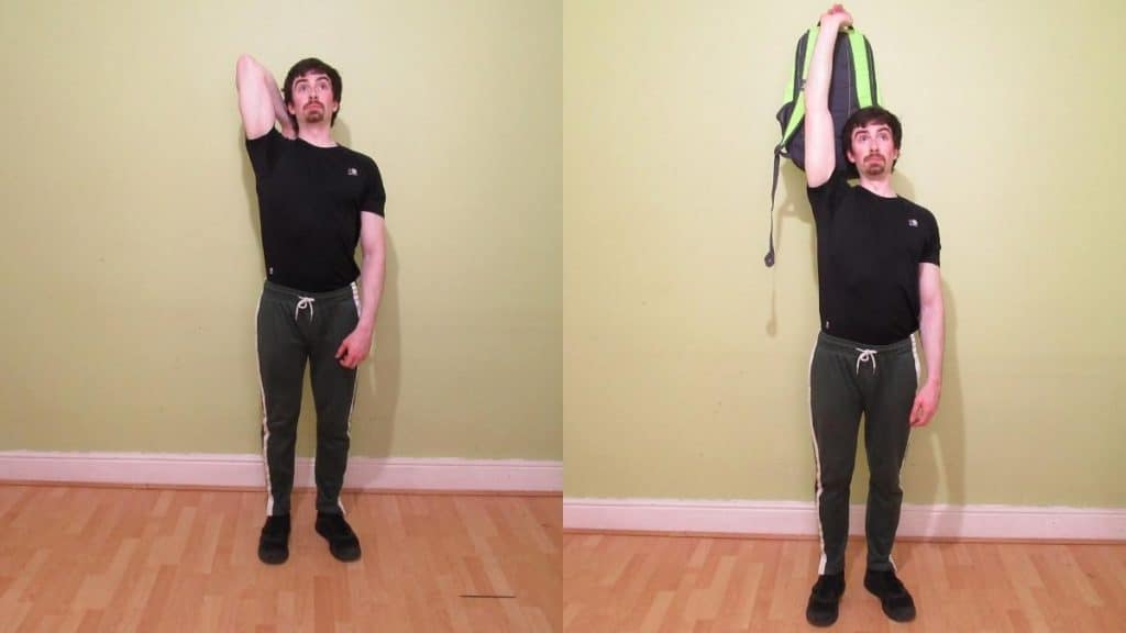 A man performing a backpack overhead tricep extension