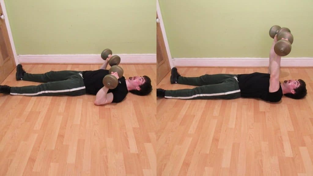 A man doing a dumbbell floor press