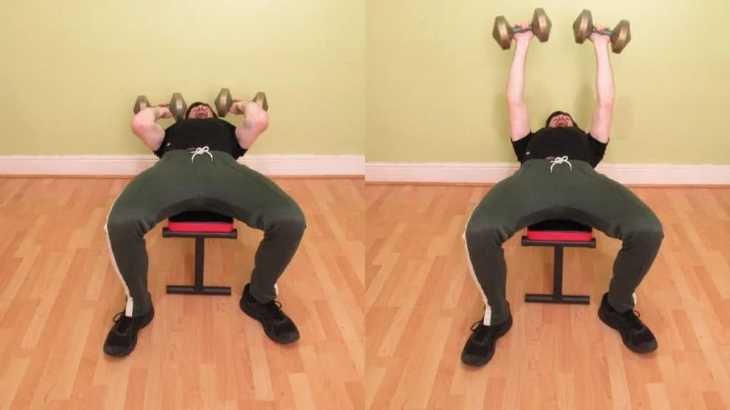 A man doing a dumbbell JM press