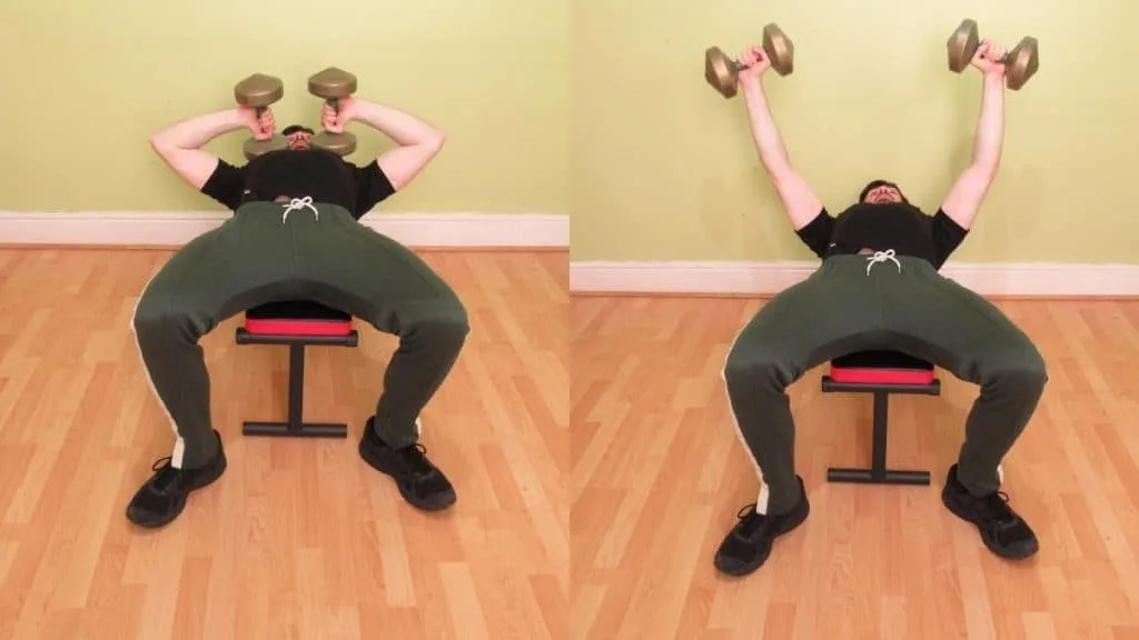 A man doing a dumbbell Tate press