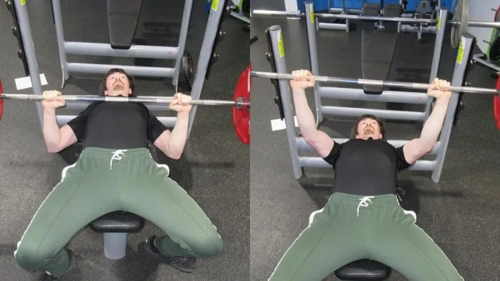 A man doing a flat barbell bench press