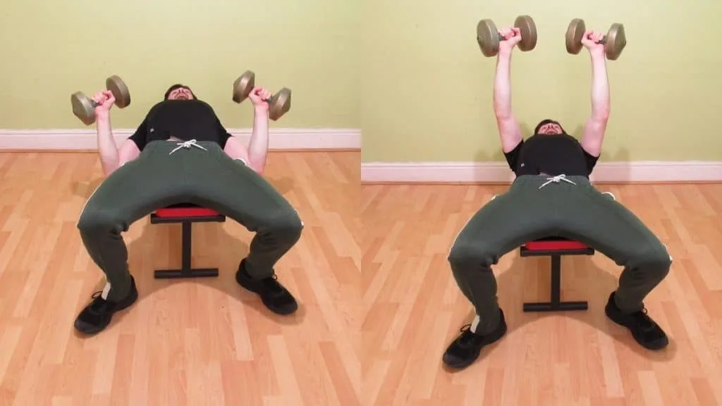 A man doing a flat dumbbell bench press