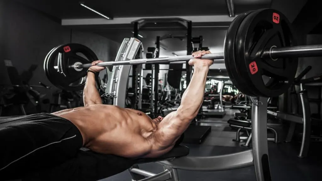 A man doing a heavy bench press