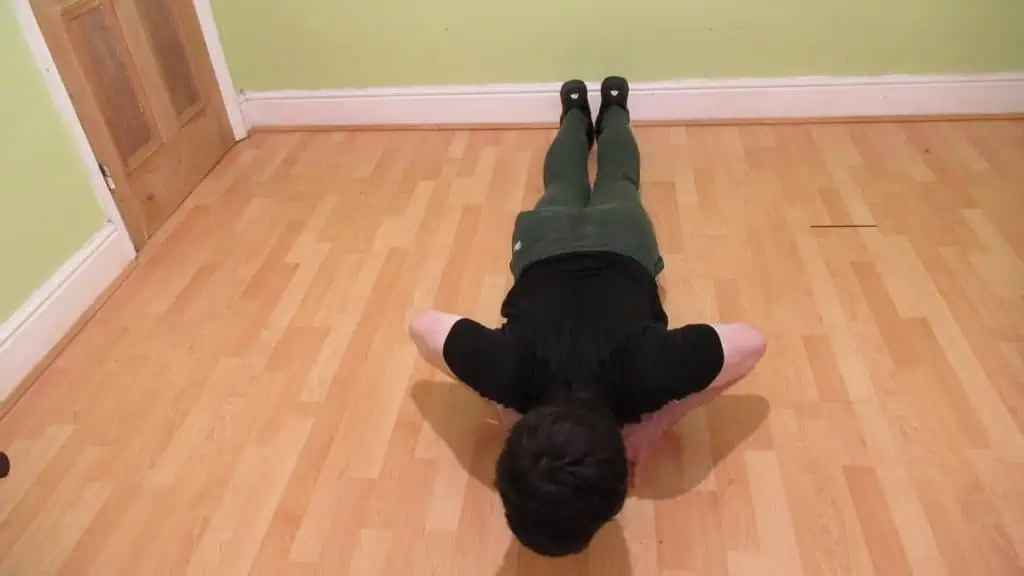 A man doing an isometric diamond push up