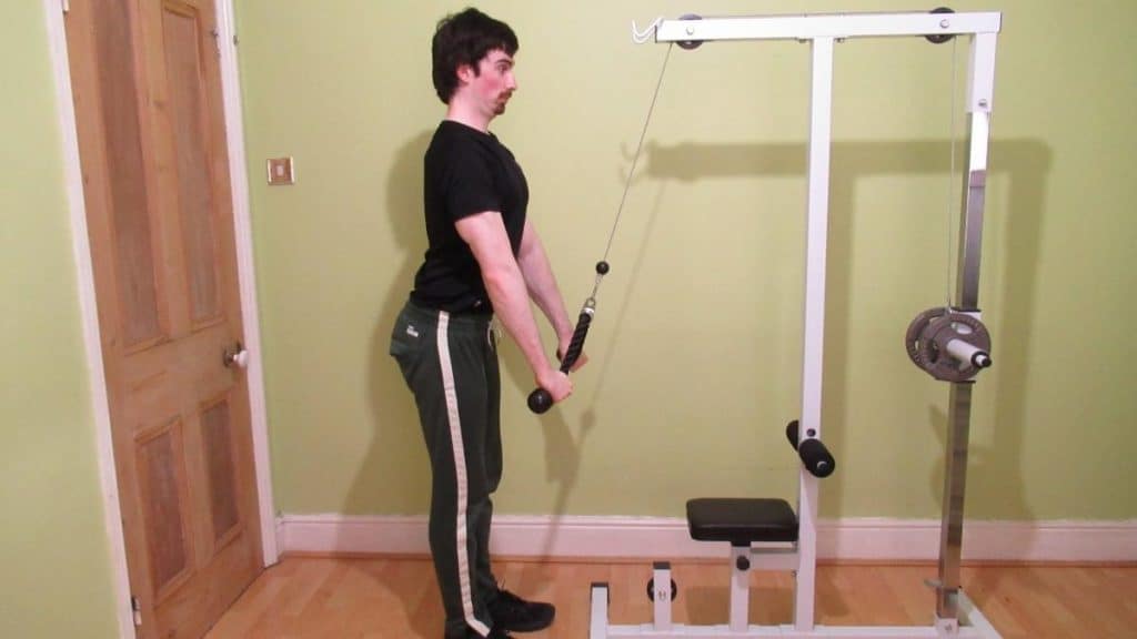 A weight lifter doing an isometric tricep squeeze