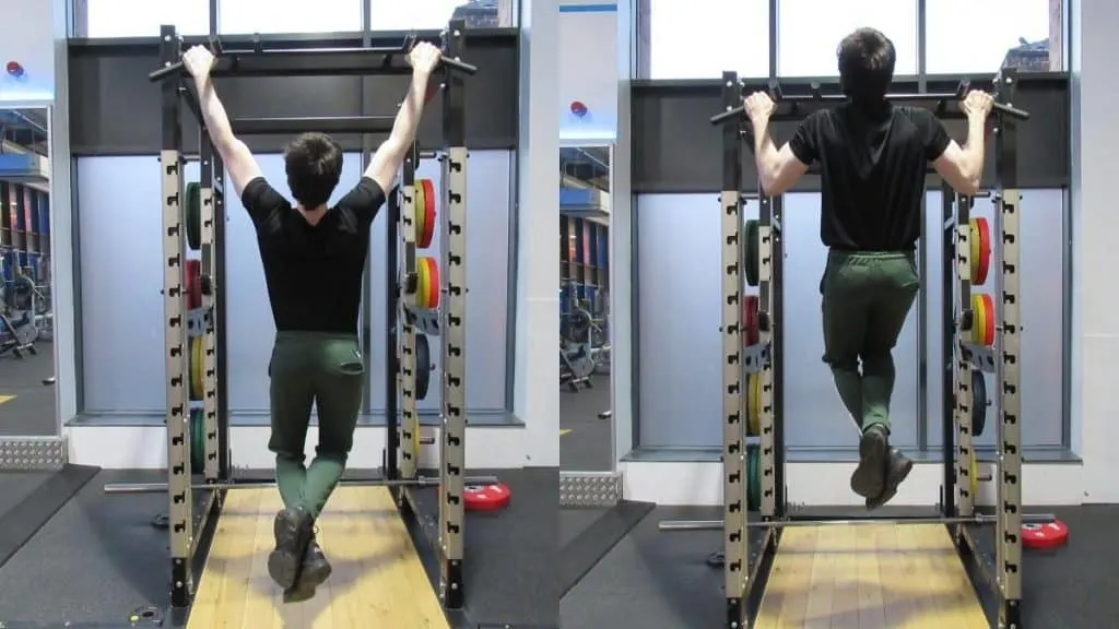 A man doing pull ups at the gym