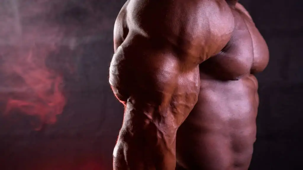 A bodybuilder with small biceps and big triceps