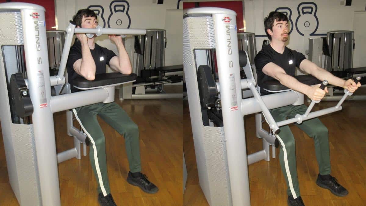 A man using some tricep exercise equipment during his workout at the gym