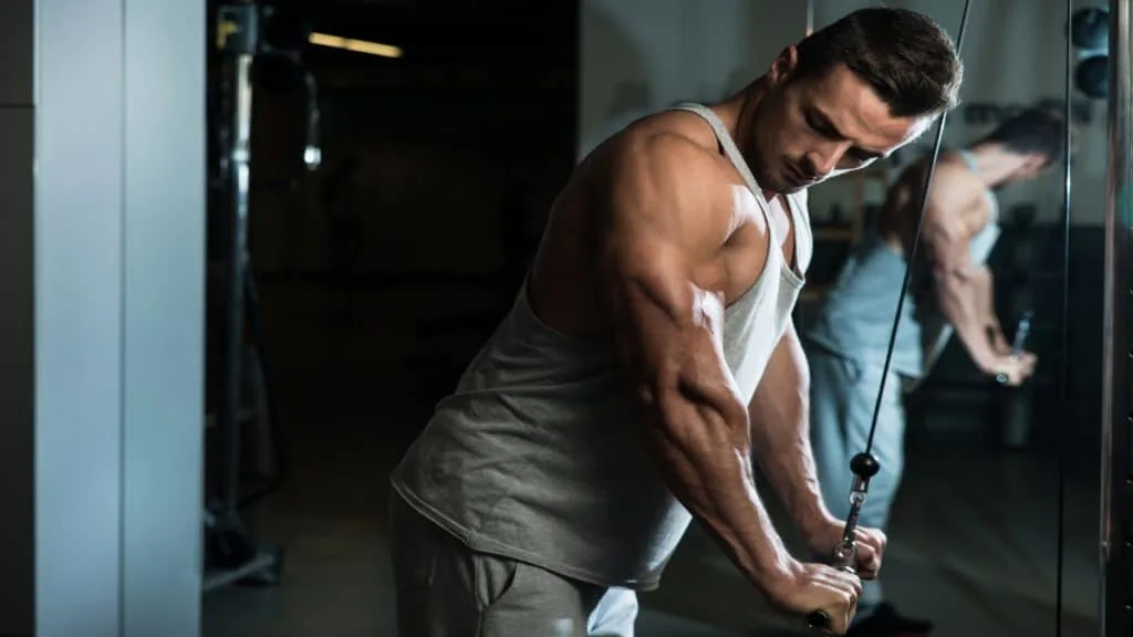 A man doing tricep pushdowns