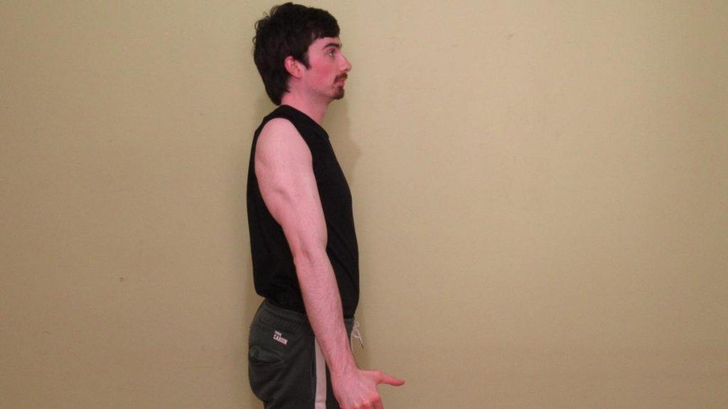 A man doing a side triceps flex