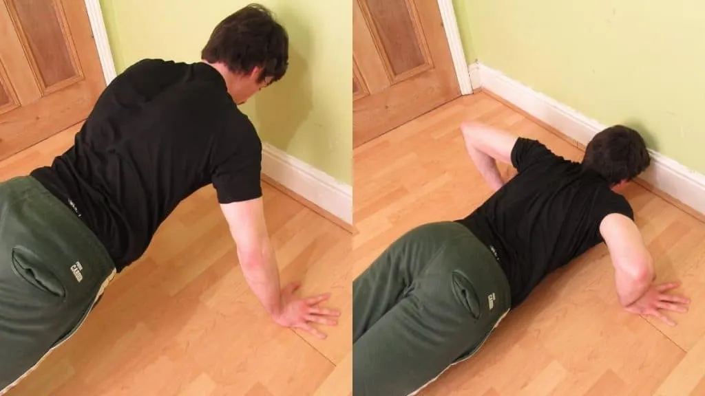 A man doing wide grip push ups