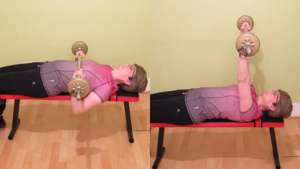 A woman doing a bench press