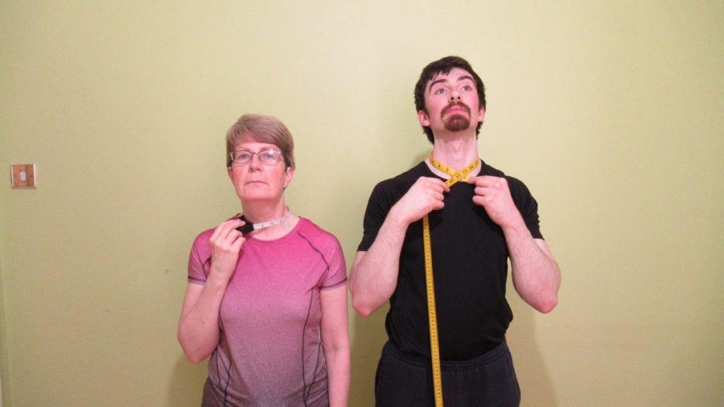 A man and a woman demonstrating the average neck circumference by height