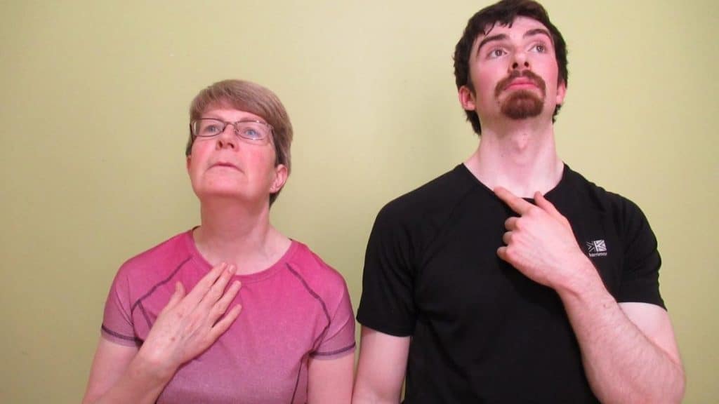 A woman and a man displaying their neck measurement