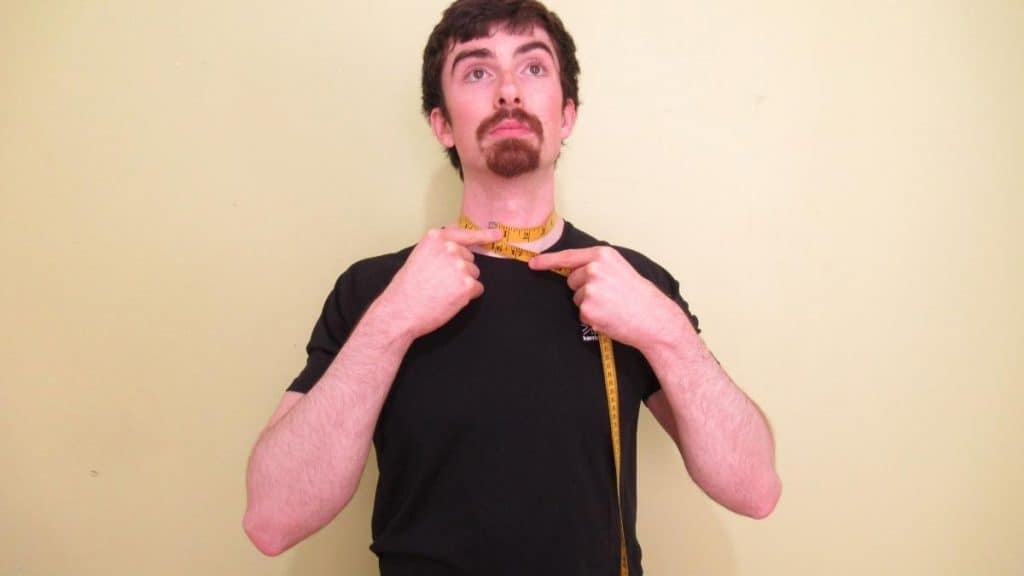 A man displaying his very normal neck circumference measurement