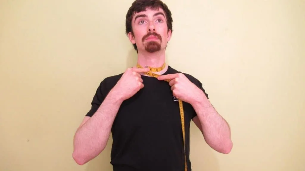 A man displaying his very normal neck circumference measurement