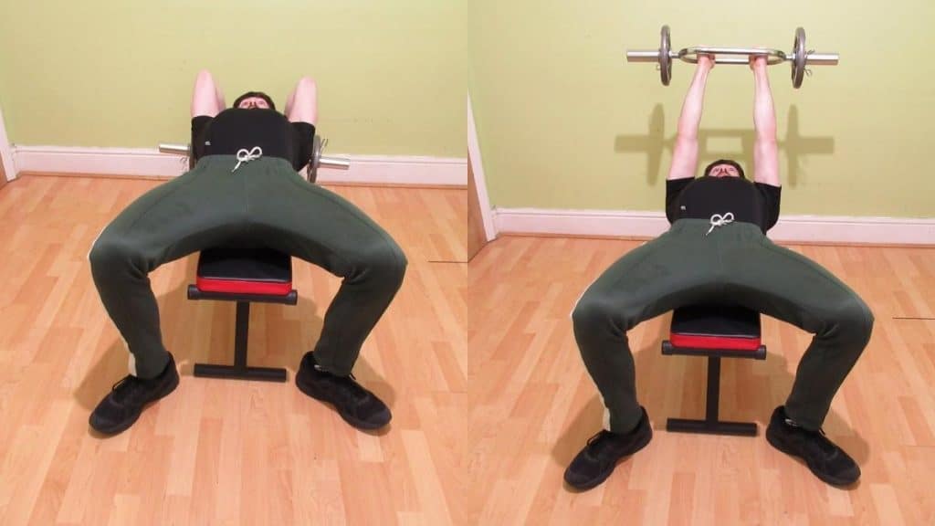 A man performing a tricep bar tricep extension