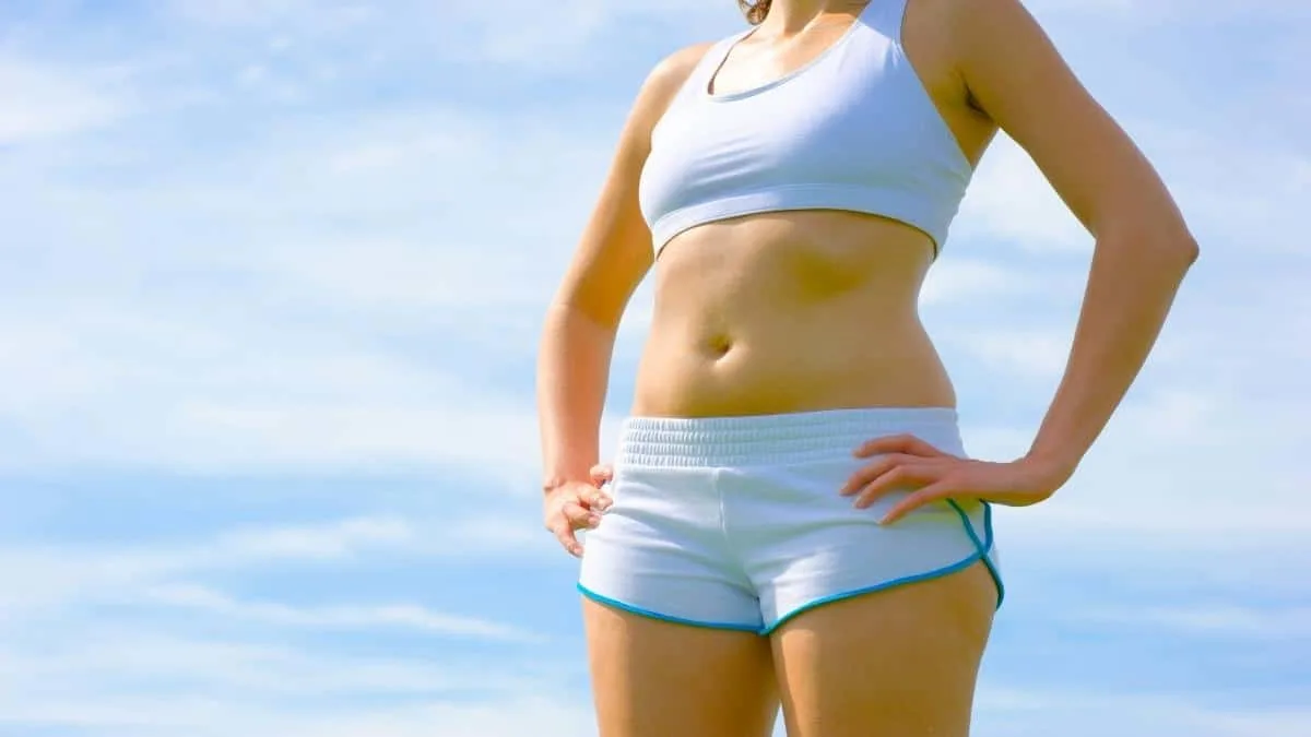 A woman putting her hands on her 42 inch hips