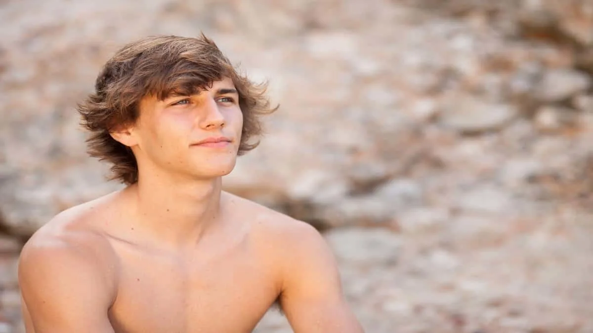 A young man showing his 45 inch shoulders