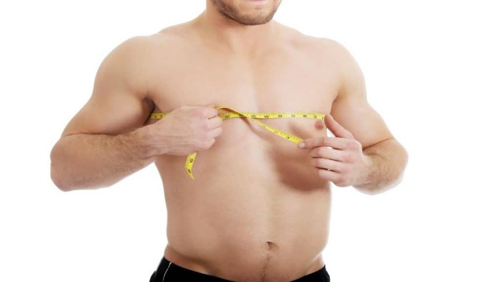 A man measuring his 47 in chest