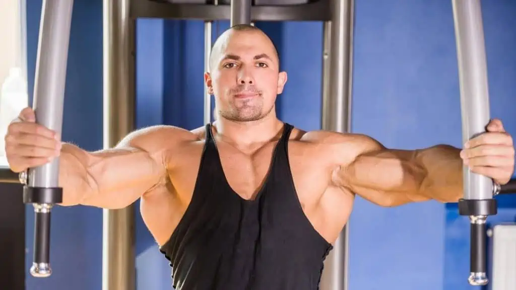 A man training his big 47 inch chest at the gym