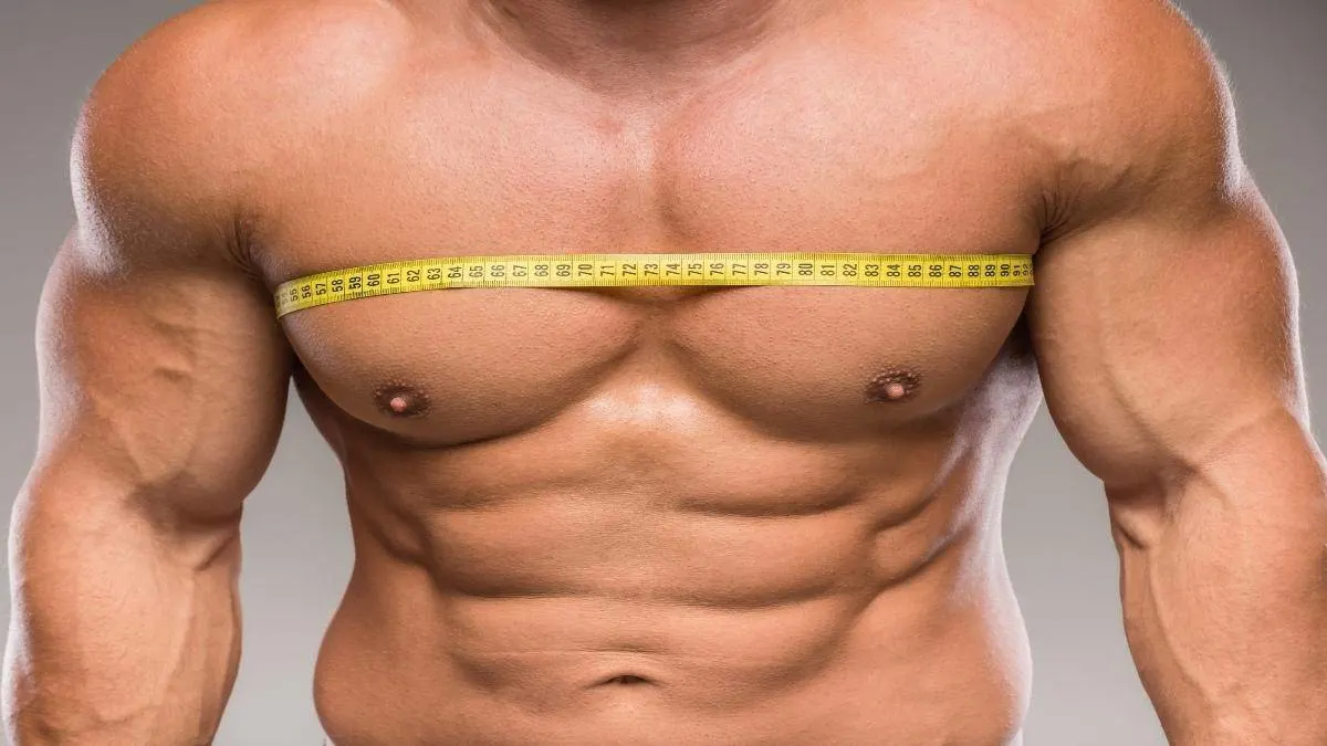 A man showing the sheer size of his 47 inch chest