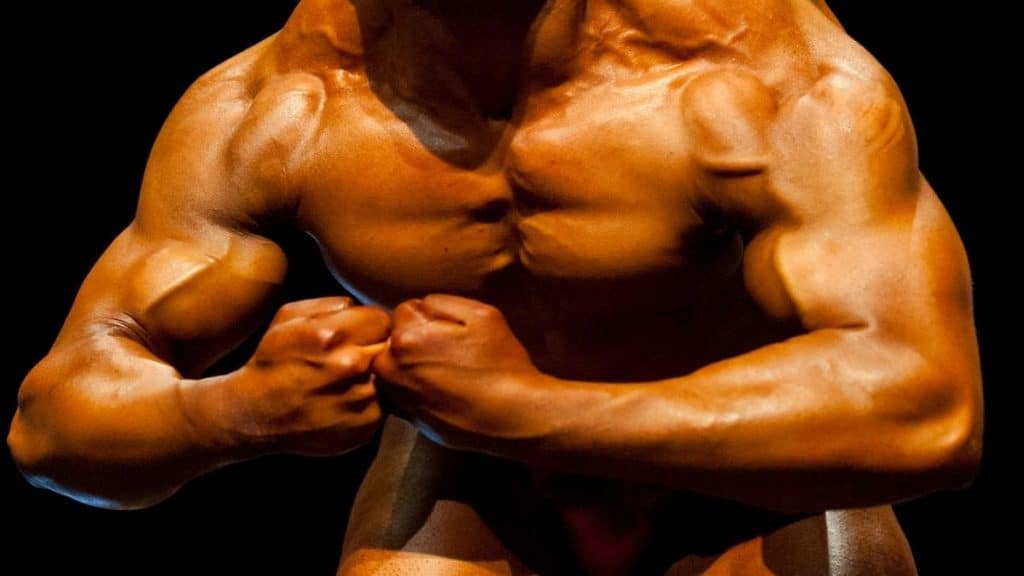 A bodybuilder flexing his big 48 inch chest