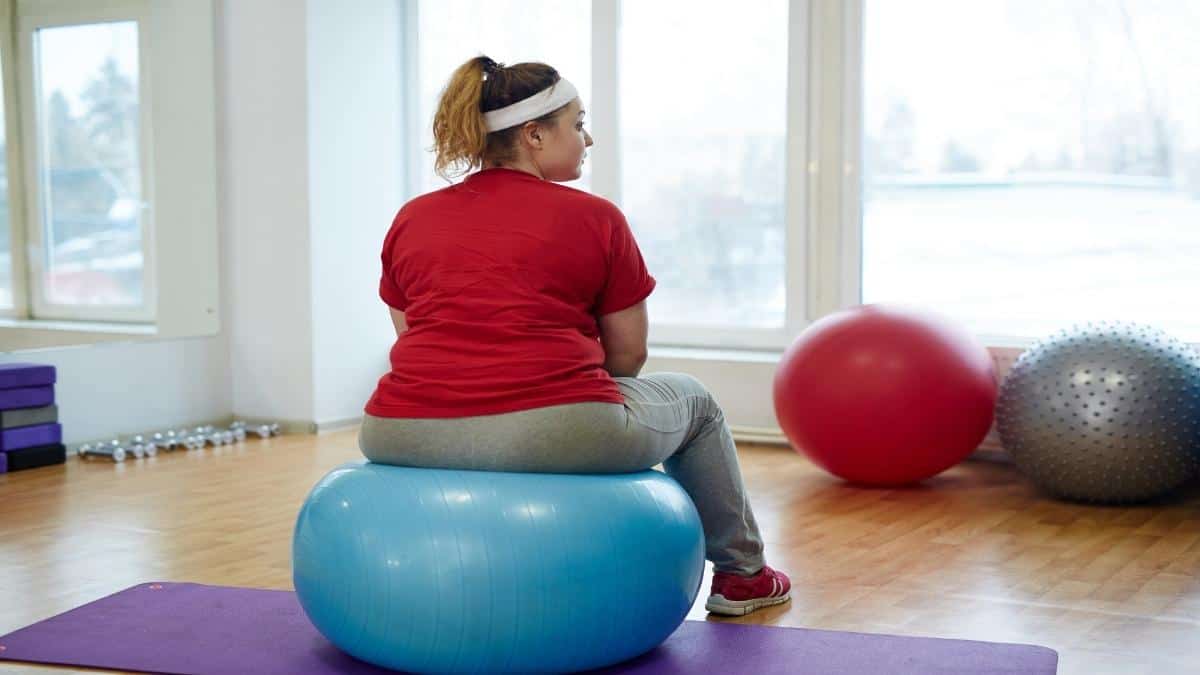 A woman with 52 inch hips sat on an exercise ball