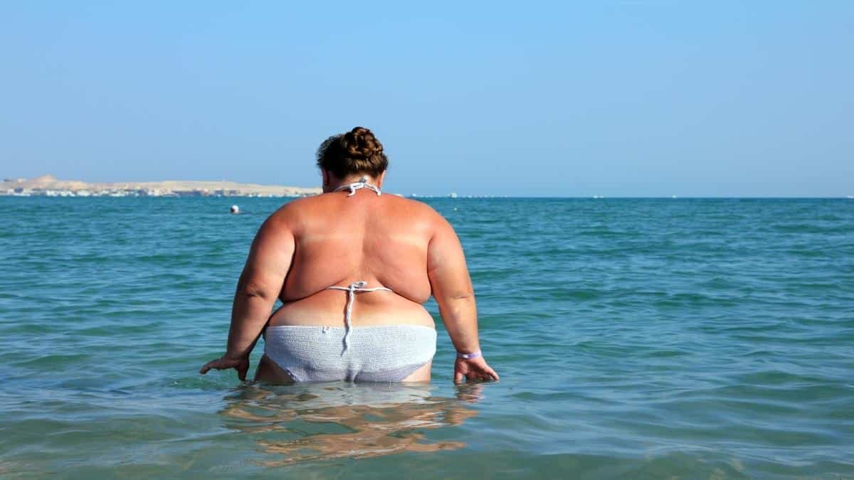 An obese woman with 58 inch hips at the beach