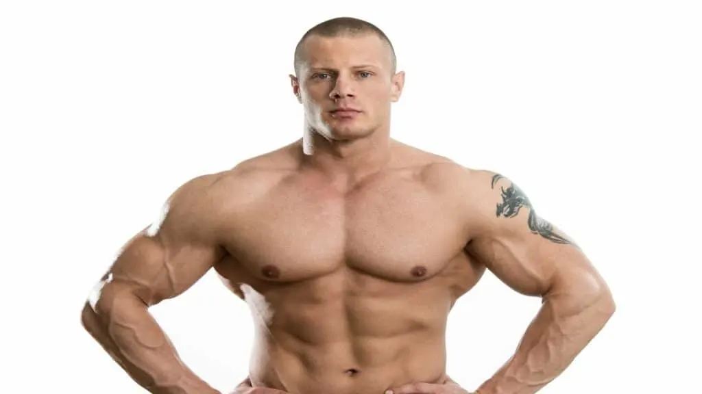 A muscular man showing his 60 in shoulders