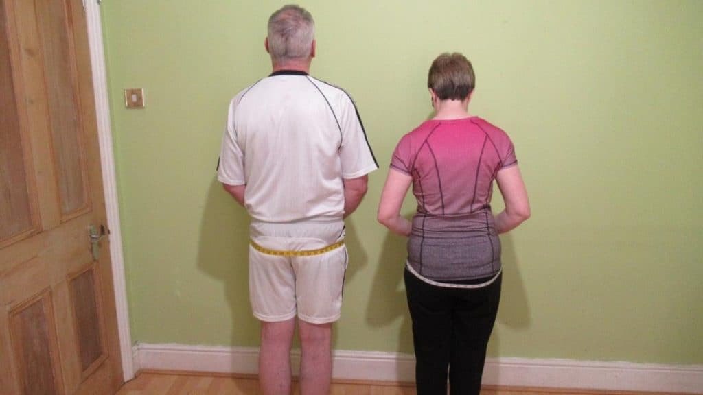 A man and a woman showing that they have an average glute size