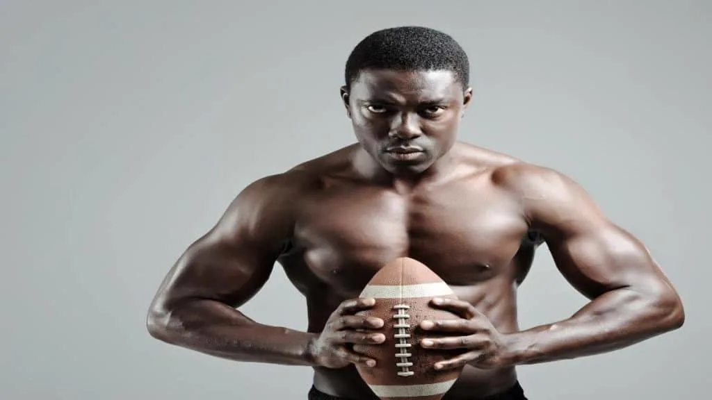 An American football player showing that he has some of the biggest shoulders in the NFL